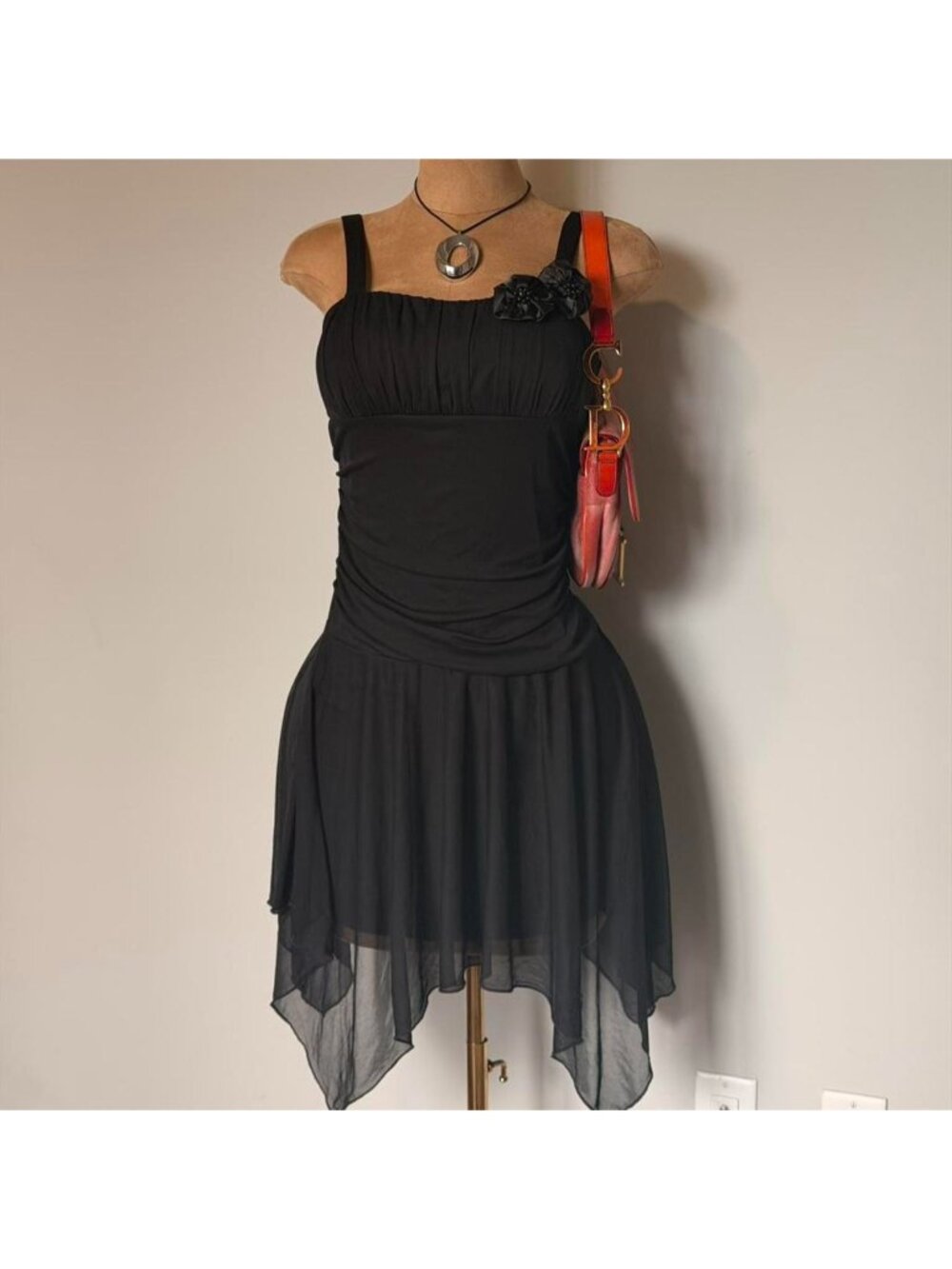 Sweet Storm black mini dress with ruched detailing and asymmetrical hem
